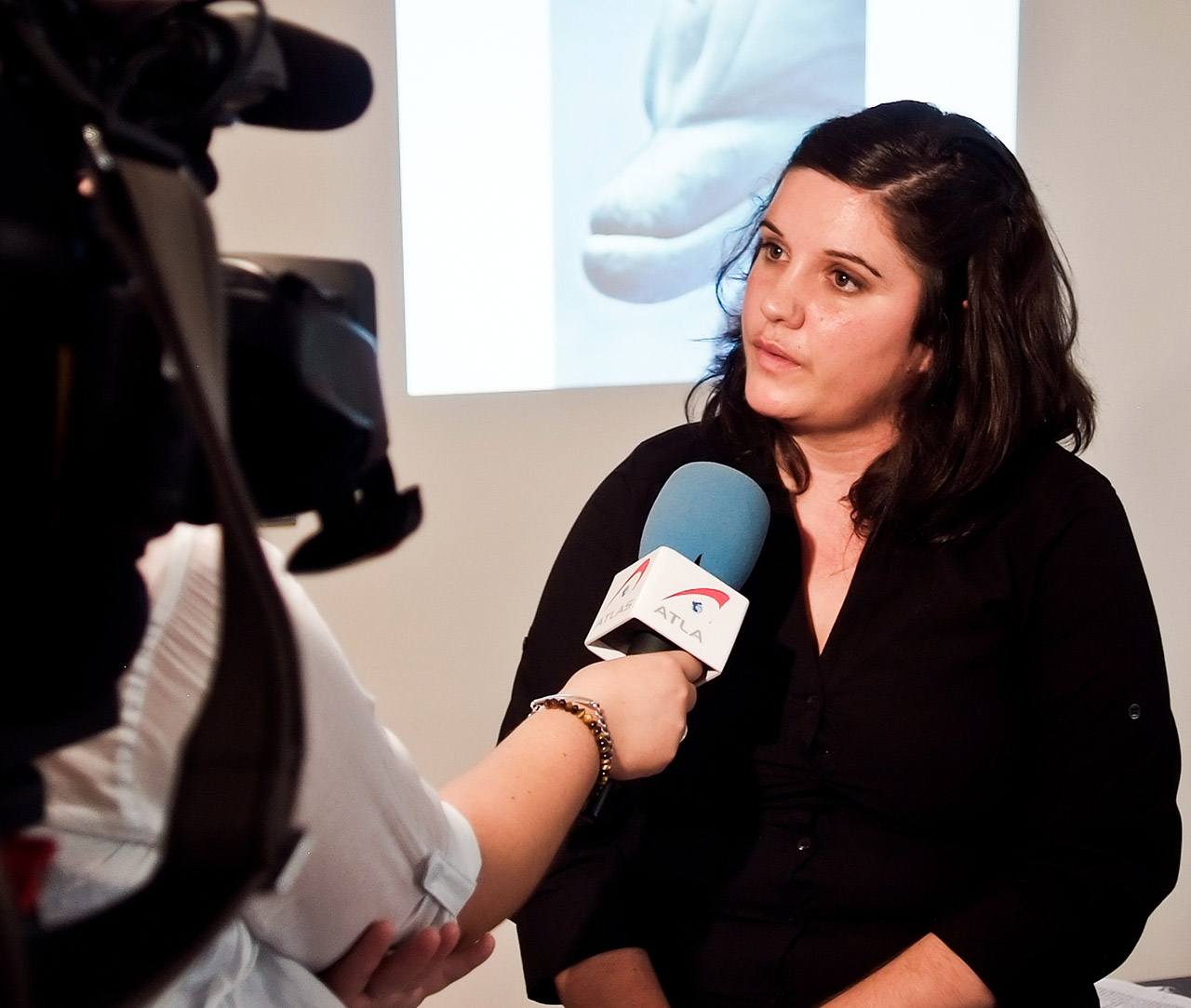 Sharon Núñez giving interview