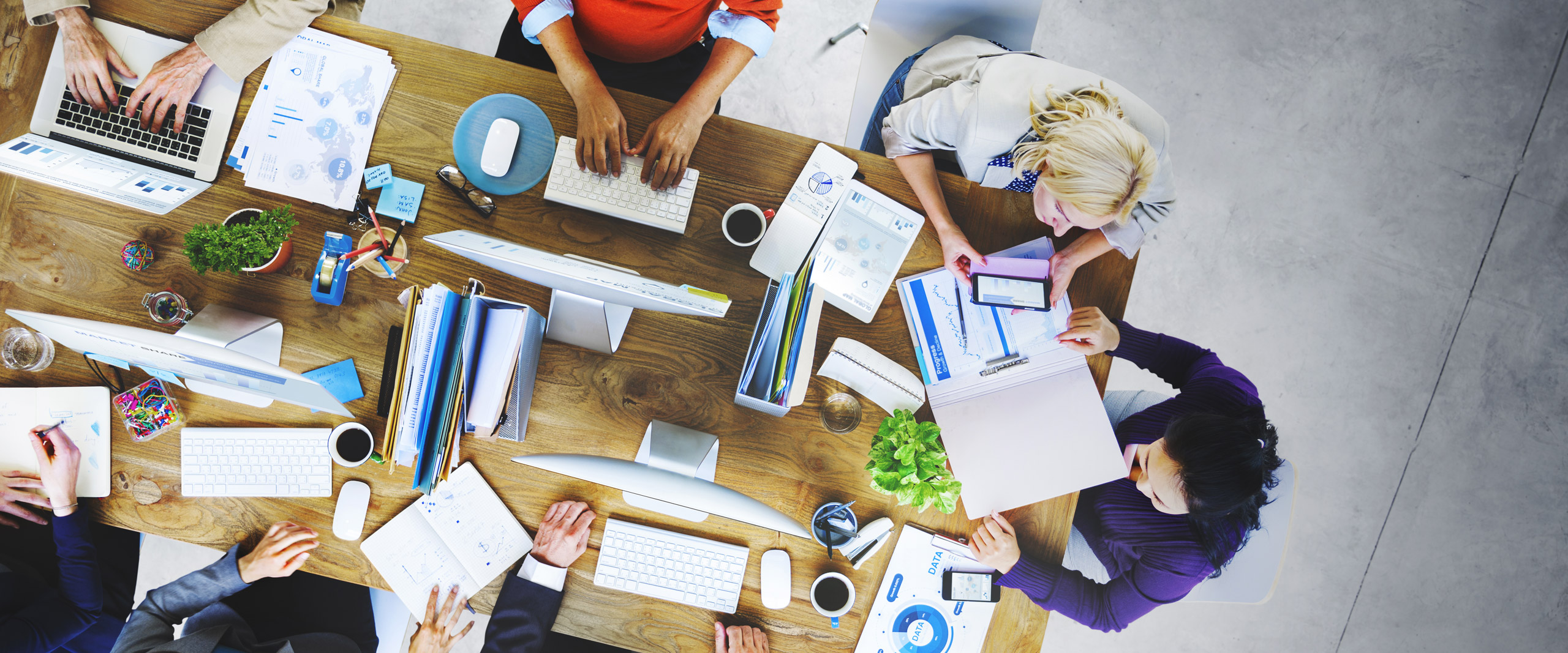 Table with many people working together